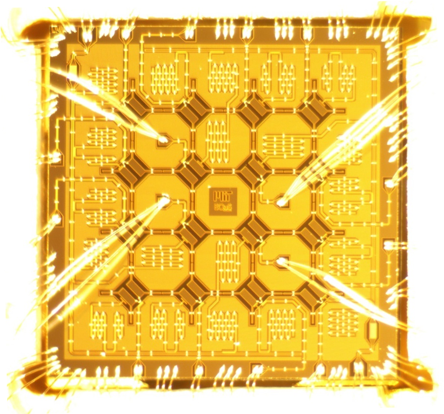 A photo of a superconducting quantum hip with 16 qubits. 