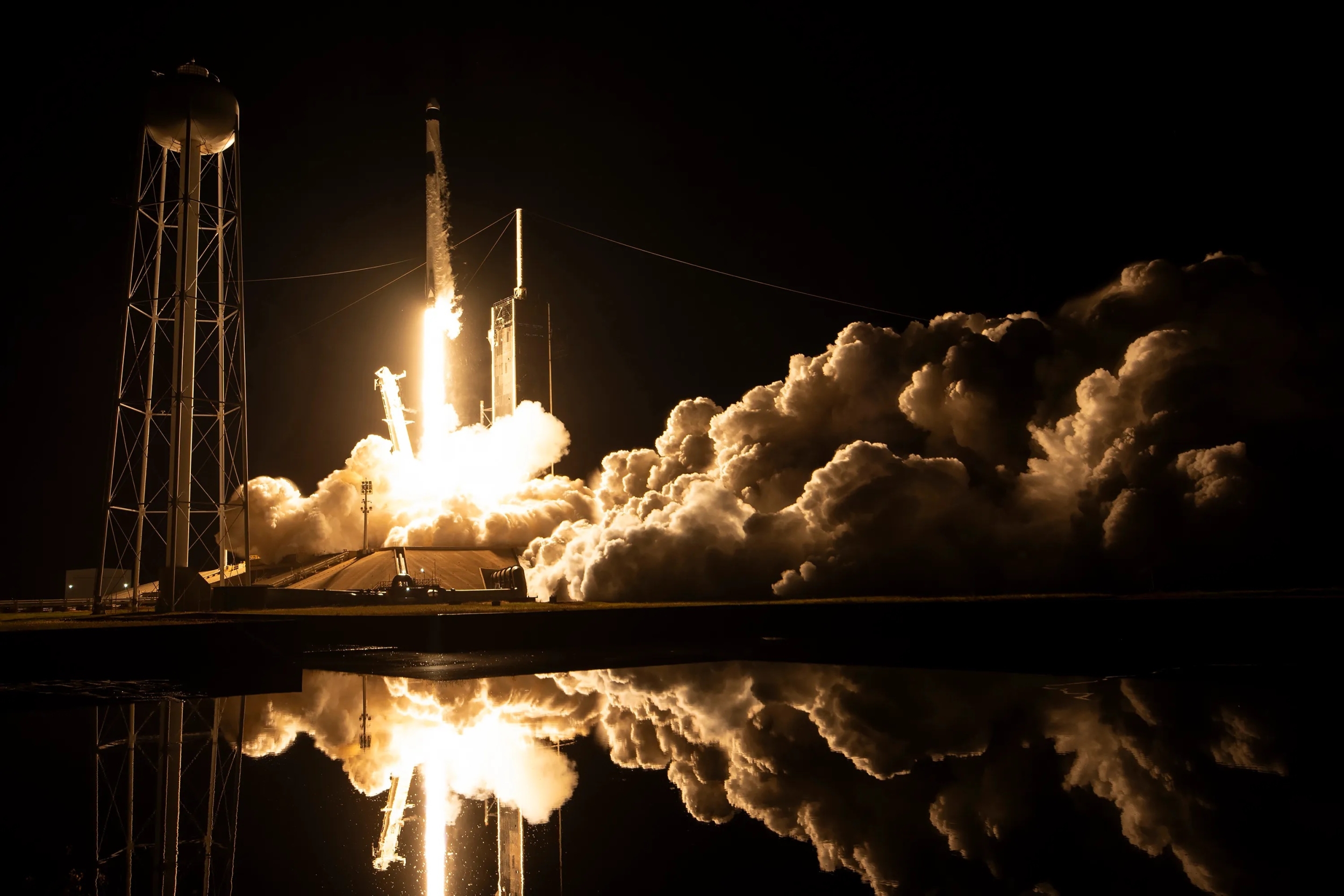 A rocket carrying a spacecraft lifts off. 