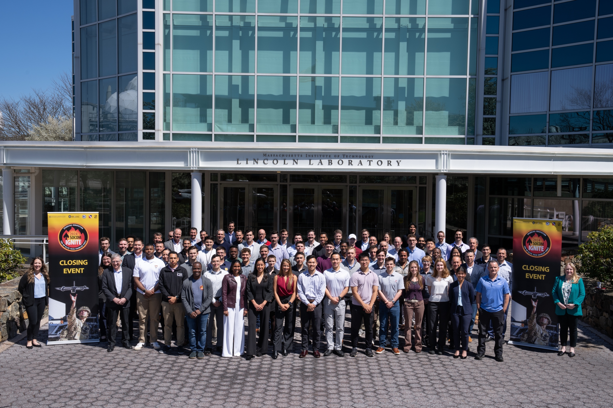 More than 80 cadets gather outside of Lincoln Laboratory for a group photo.