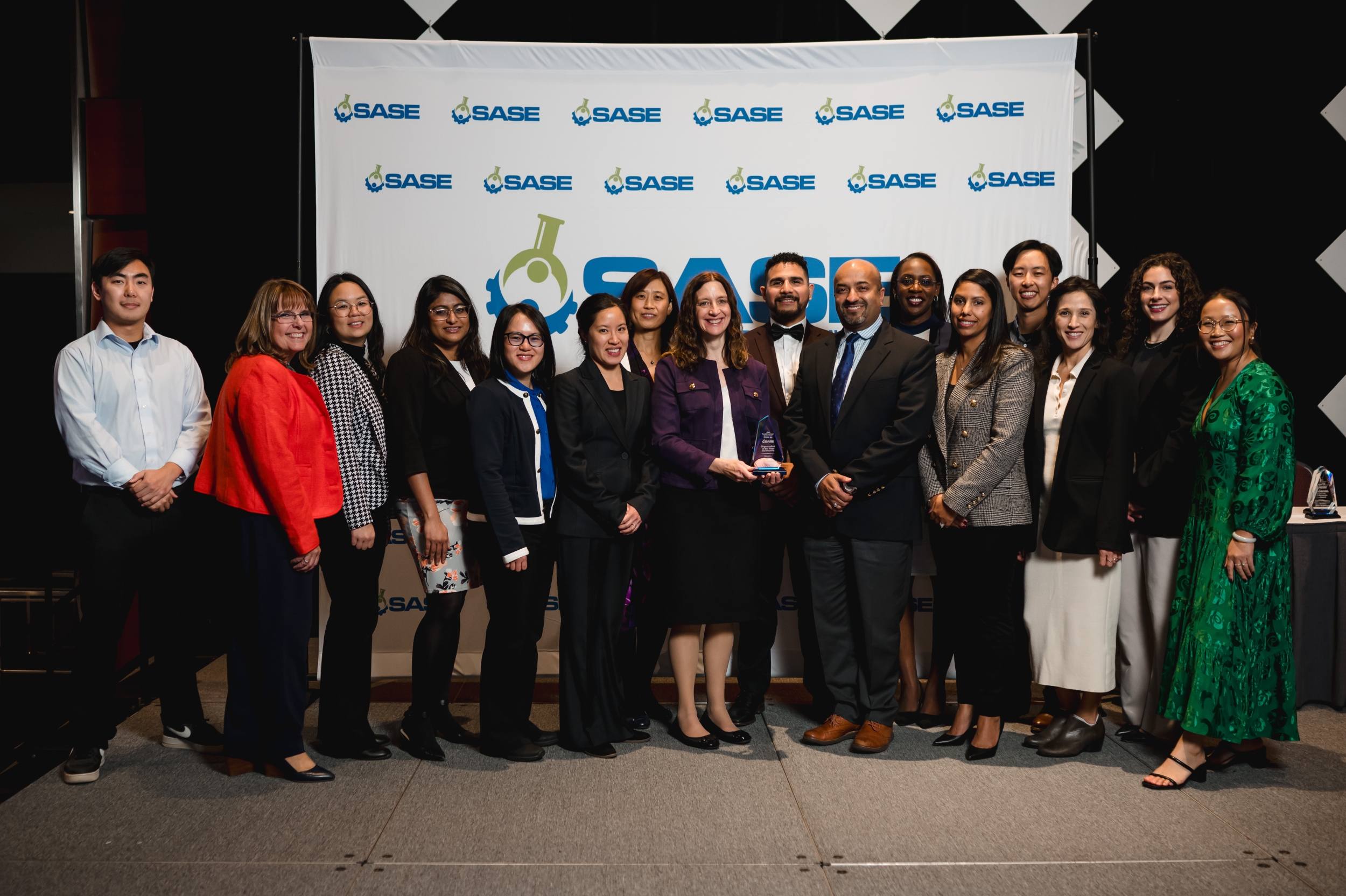 Laboratory staff from Human Resources, PALS, and other areas of the Laboratory gathered for a photo celebrating the SASE Government Organization of the Year Award.