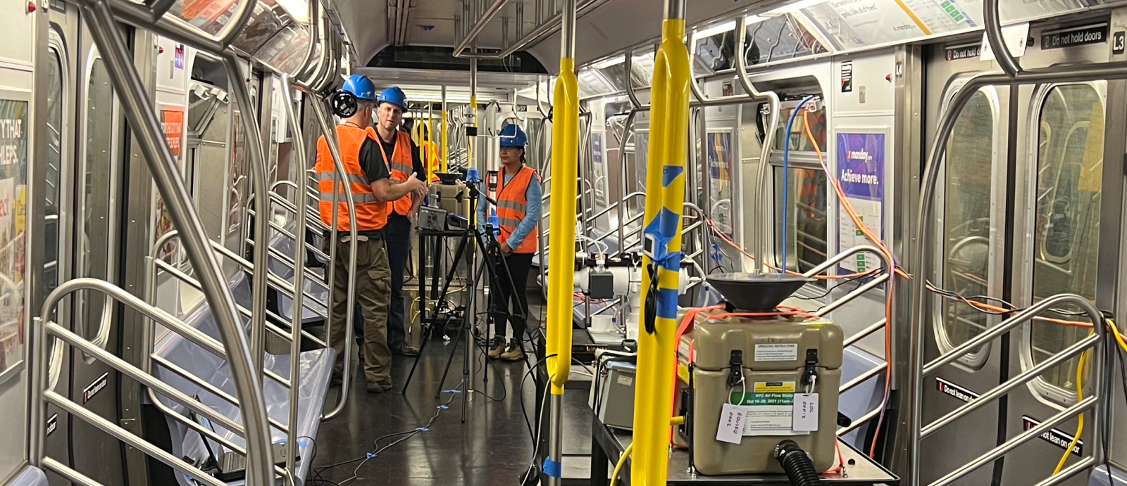 A photo of the study team conducts tests on an NYC subway car. 