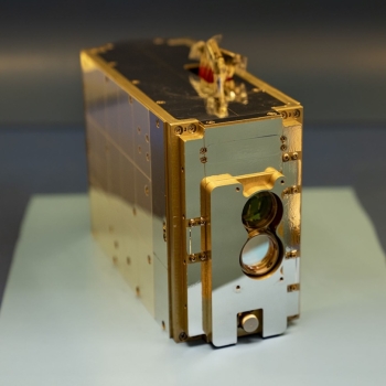 A small laser communications payload is on display.