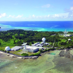 A photograph of a suite of radars on an island. 